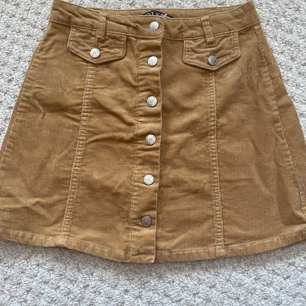 Size 5, tan, corduroy skirt with buttons.
